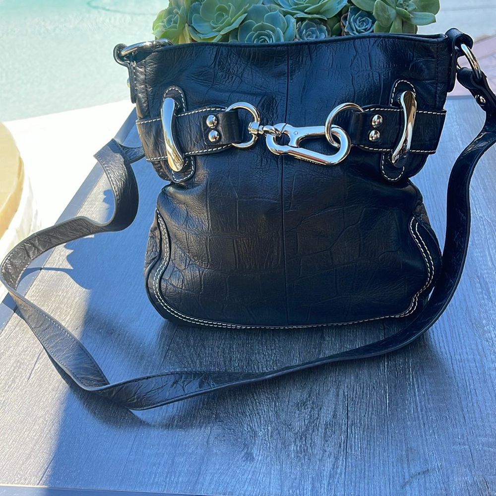 B. Makowsky Black crossbody cheetah interior